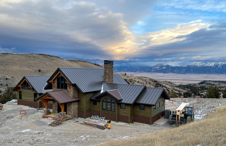 https://www.timberbuilt.com/wp-content/uploads/2022/06/montana-timber-frame-mountains-in-background.jpg